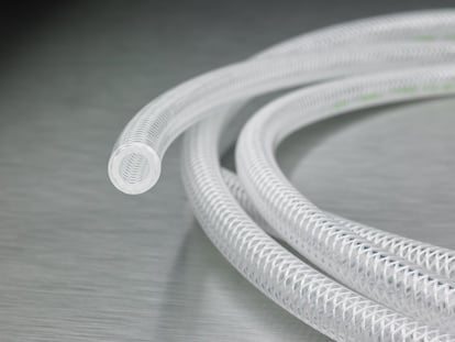 coil, upclose, stainless braided tubing on steel background