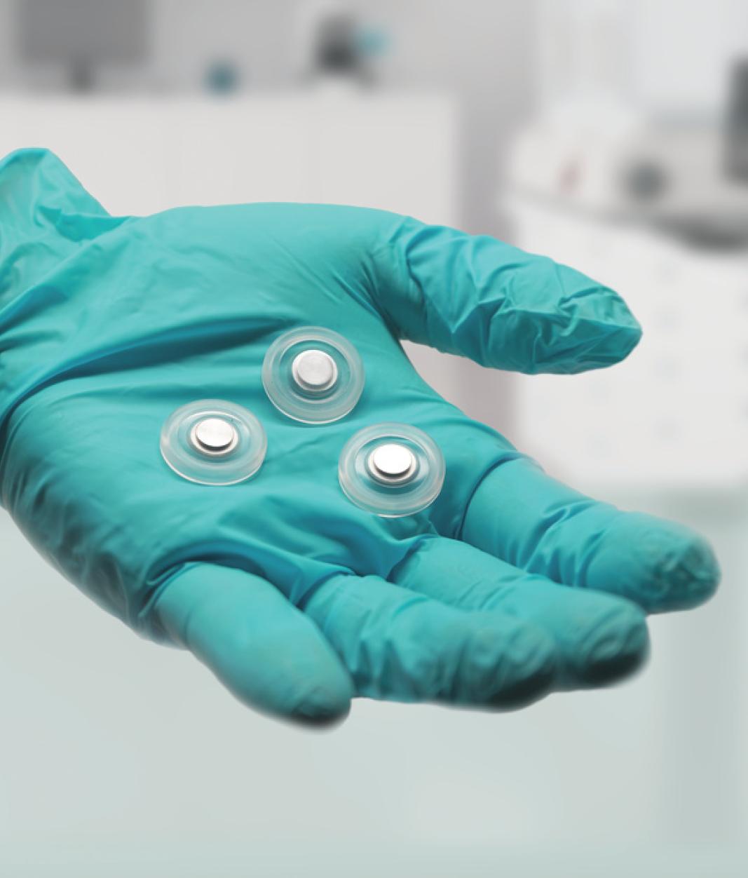 Two-shot molded parts in teal glove