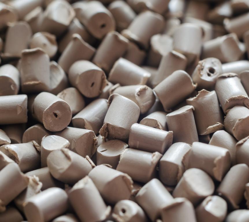 Gray polymer dye in granules, background texture.