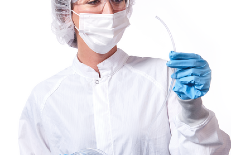 medical professional standing holding tygon medical tubing
